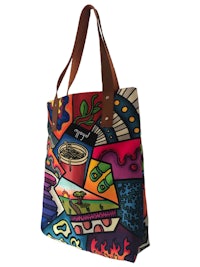 a colorful tote bag with colorful designs on it