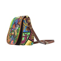 a colorful saddle bag with a brown leather strap