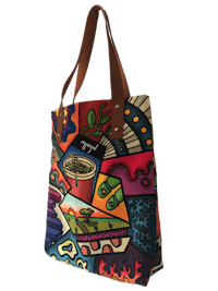 a colorful tote bag with a leather handle